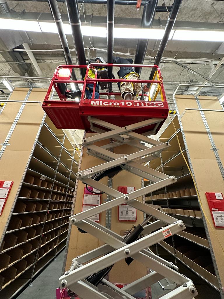 Storage facility — Micro19 lift duct access above narrow shelving aisles