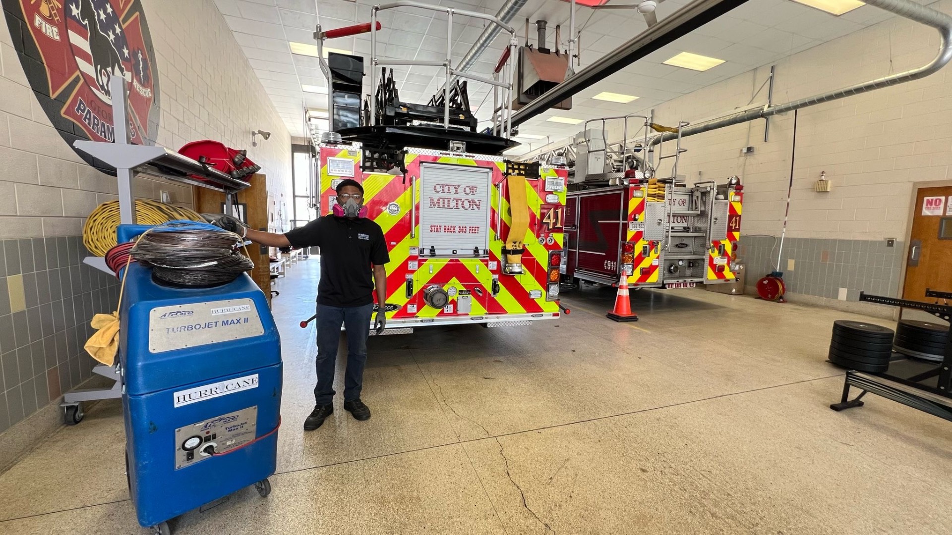 Milton Fire Station 41 — IICRC-certified technician with rotary brush rig set up behind the engine for supply duct cleaning