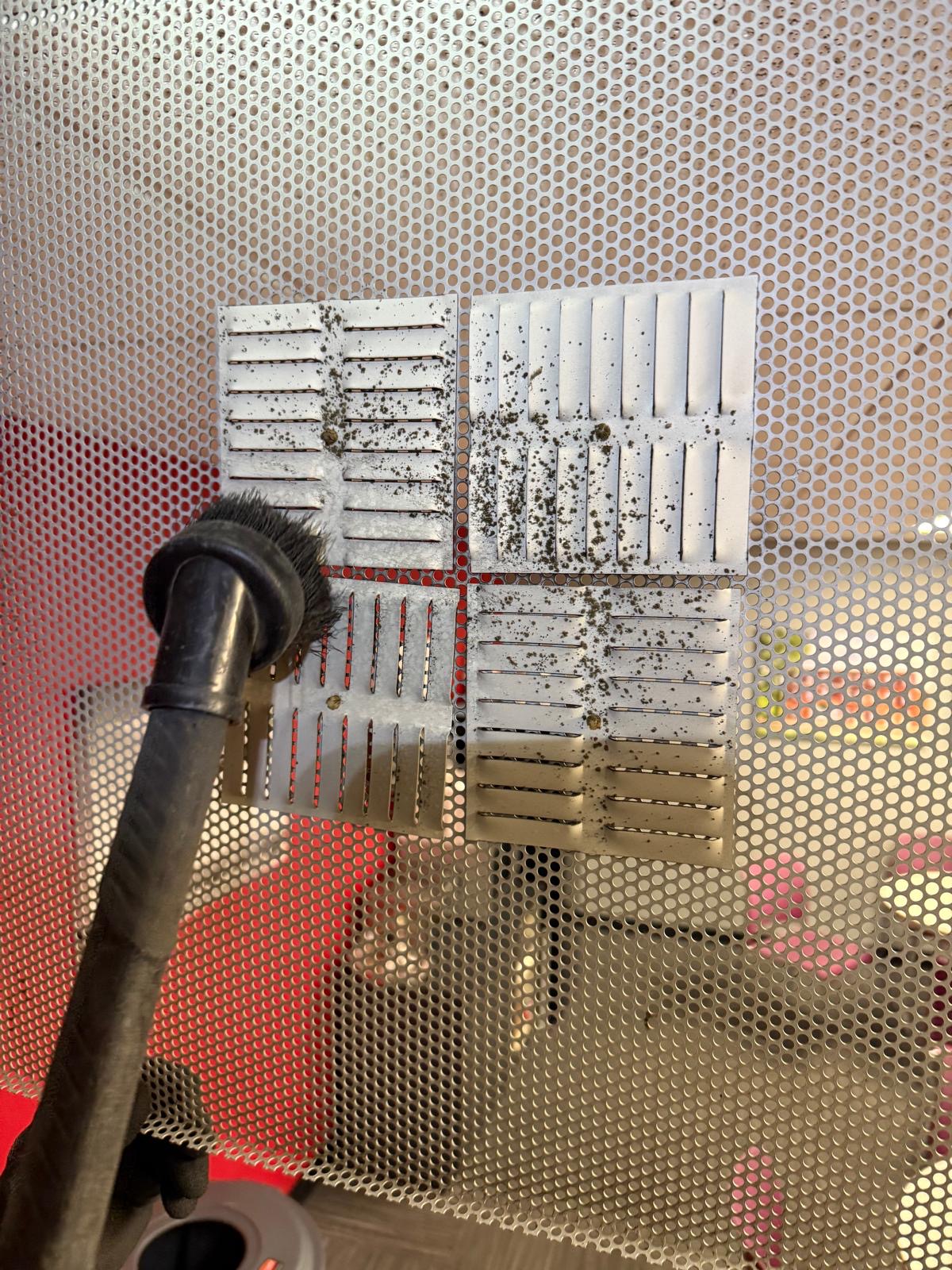 Office HVAC — pre-filter brushing with visible particulate capture