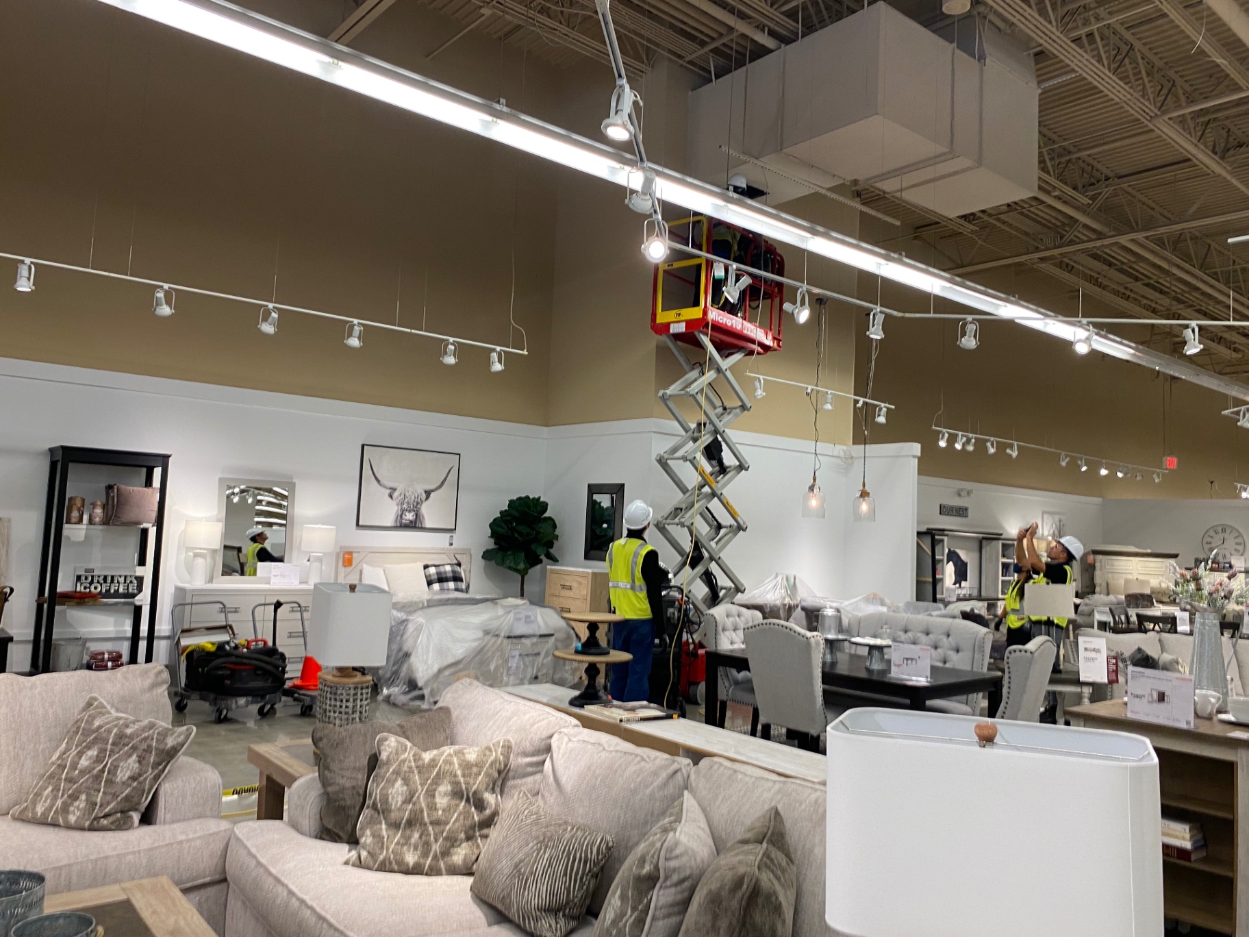 Ashley HomeStore — elevated overhead cleaning in progress