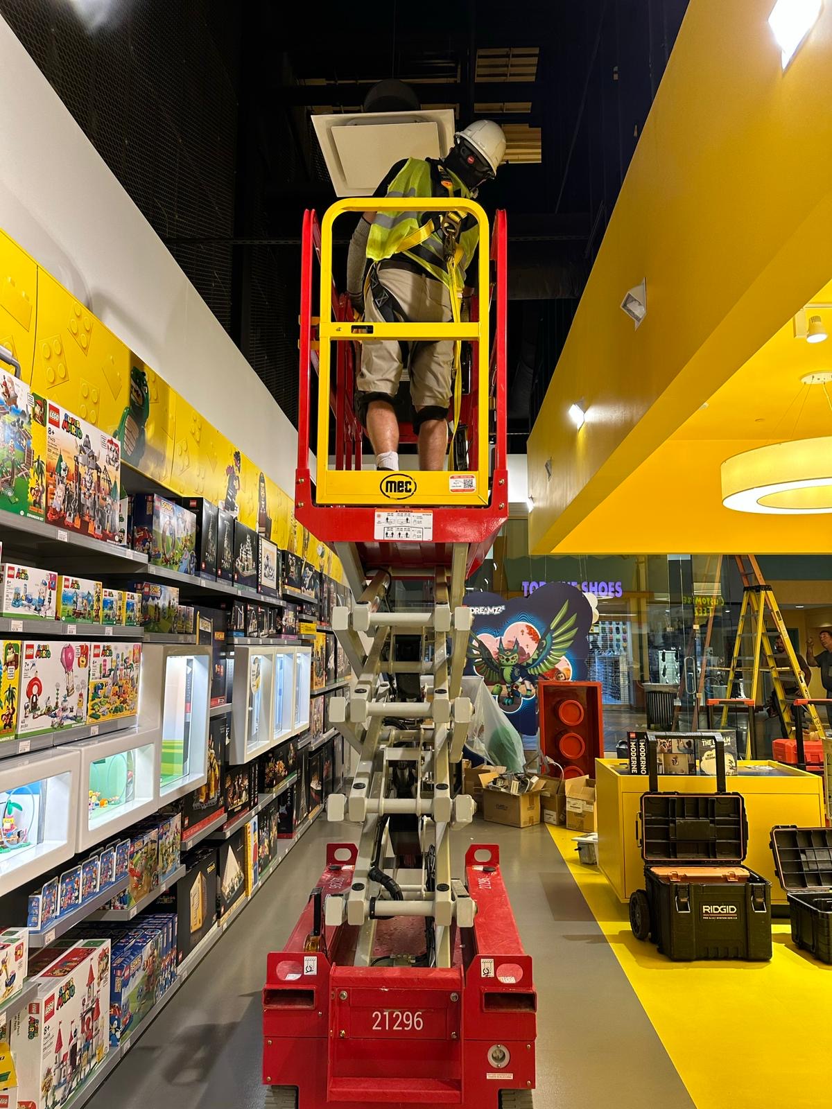 LEGO Store — ceiling tile removal for HVAC access
