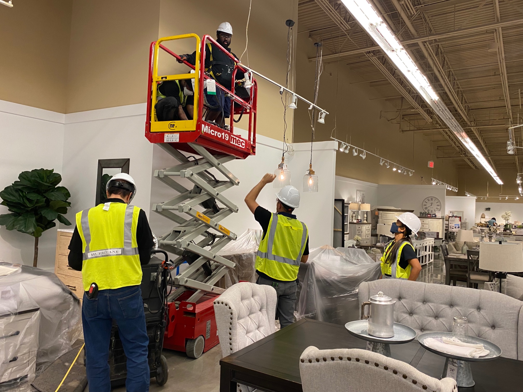 Ashley HomeStore — showroom ceiling access with lift