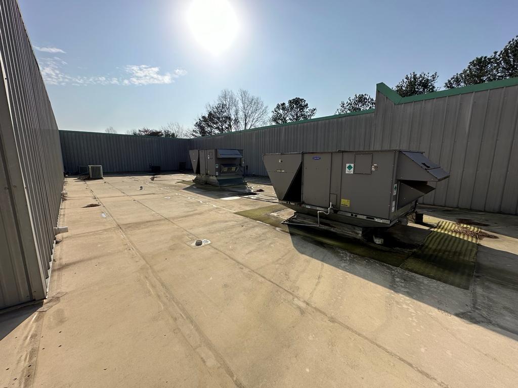 Rooftop survey — Carrier and adjacent RTUs across a flat commercial roof