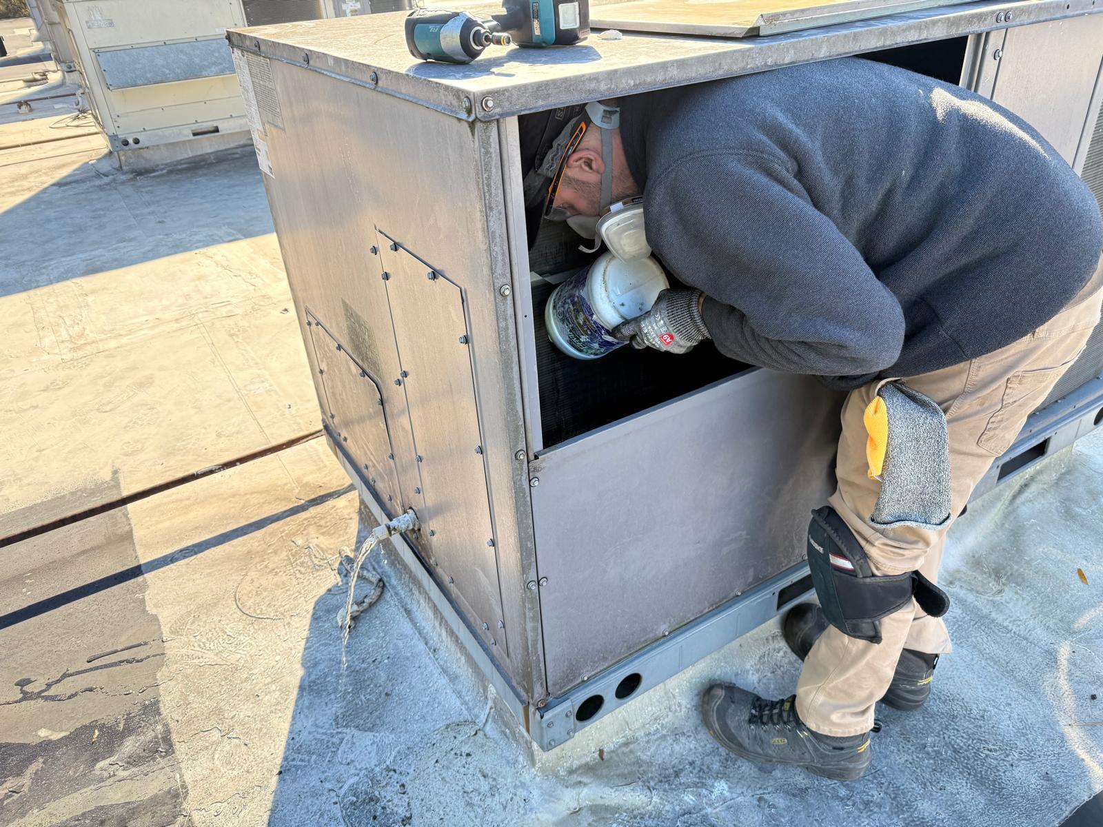 Rooftop RTU — coil sanitizing inside a packaged unit with respirator PPE
