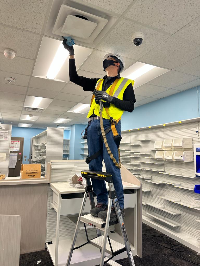Pharmacy retail — ceiling diffuser detail cleaning
