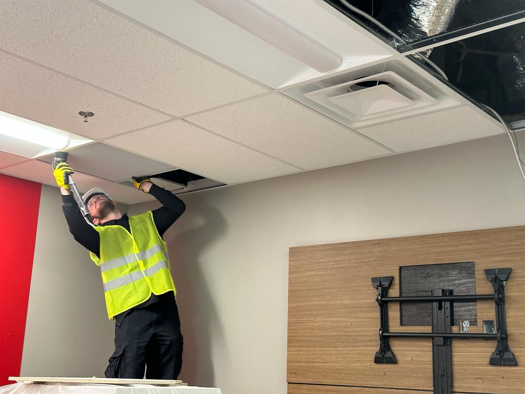 Conference room — in-ceiling duct HEPA vacuuming