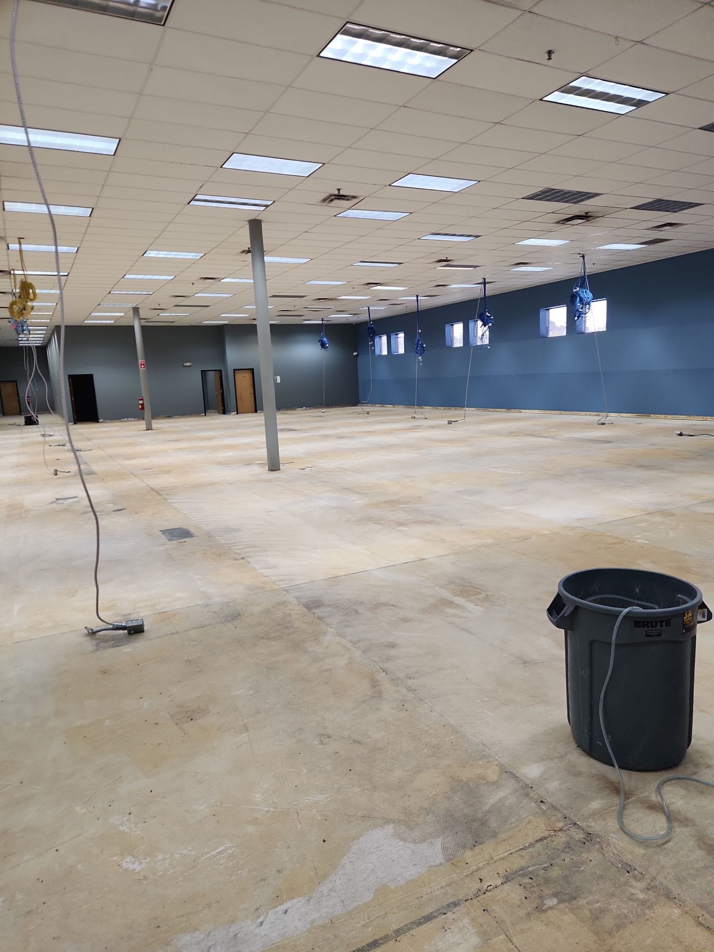 Vacant retail space — full-floor ceiling diffuser cleaning prep across the sales area