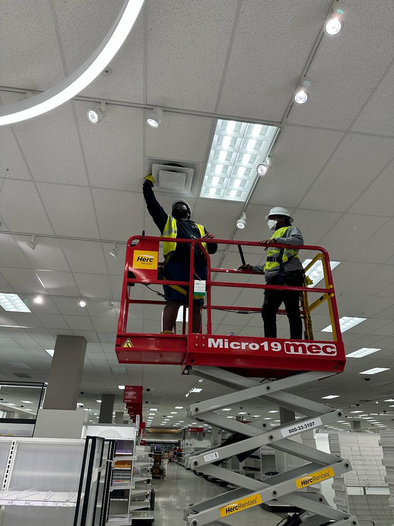 Target — scissor-lift HVAC diffuser cleaning