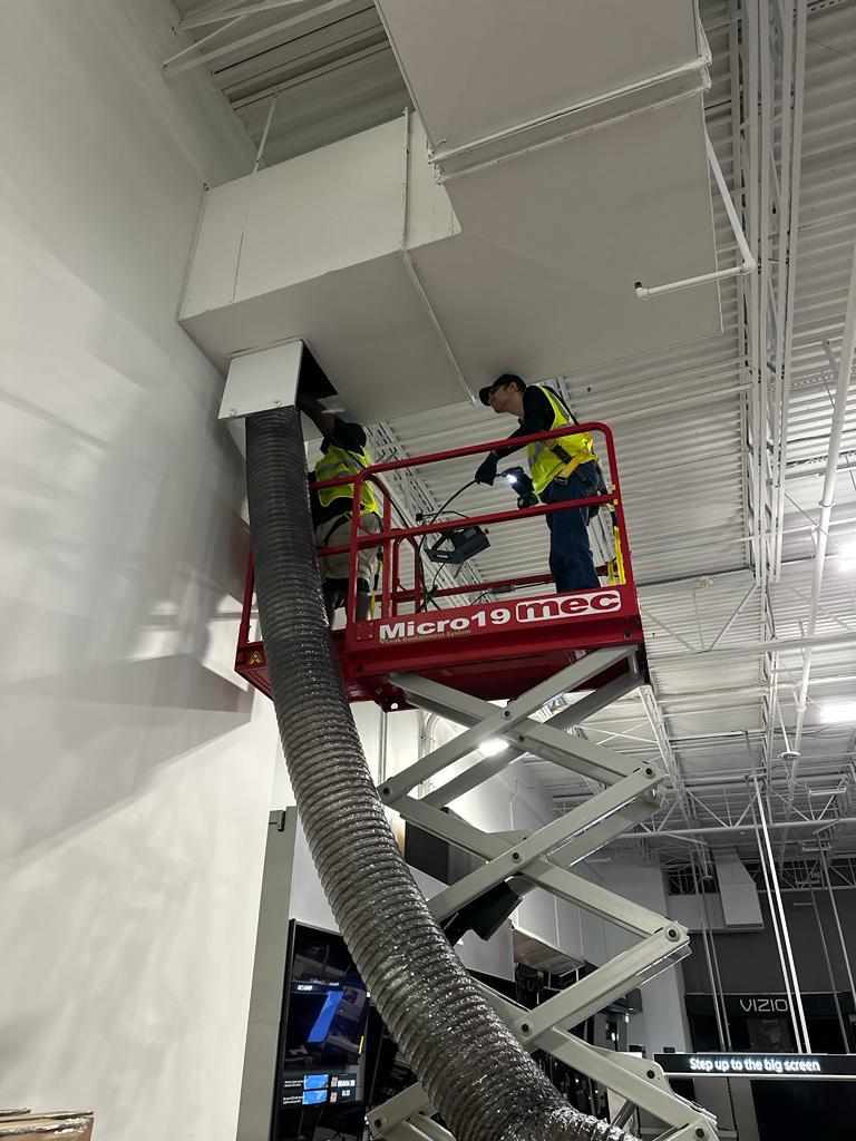 Electronics showroom — high-bay duct access with Micro19 lift
