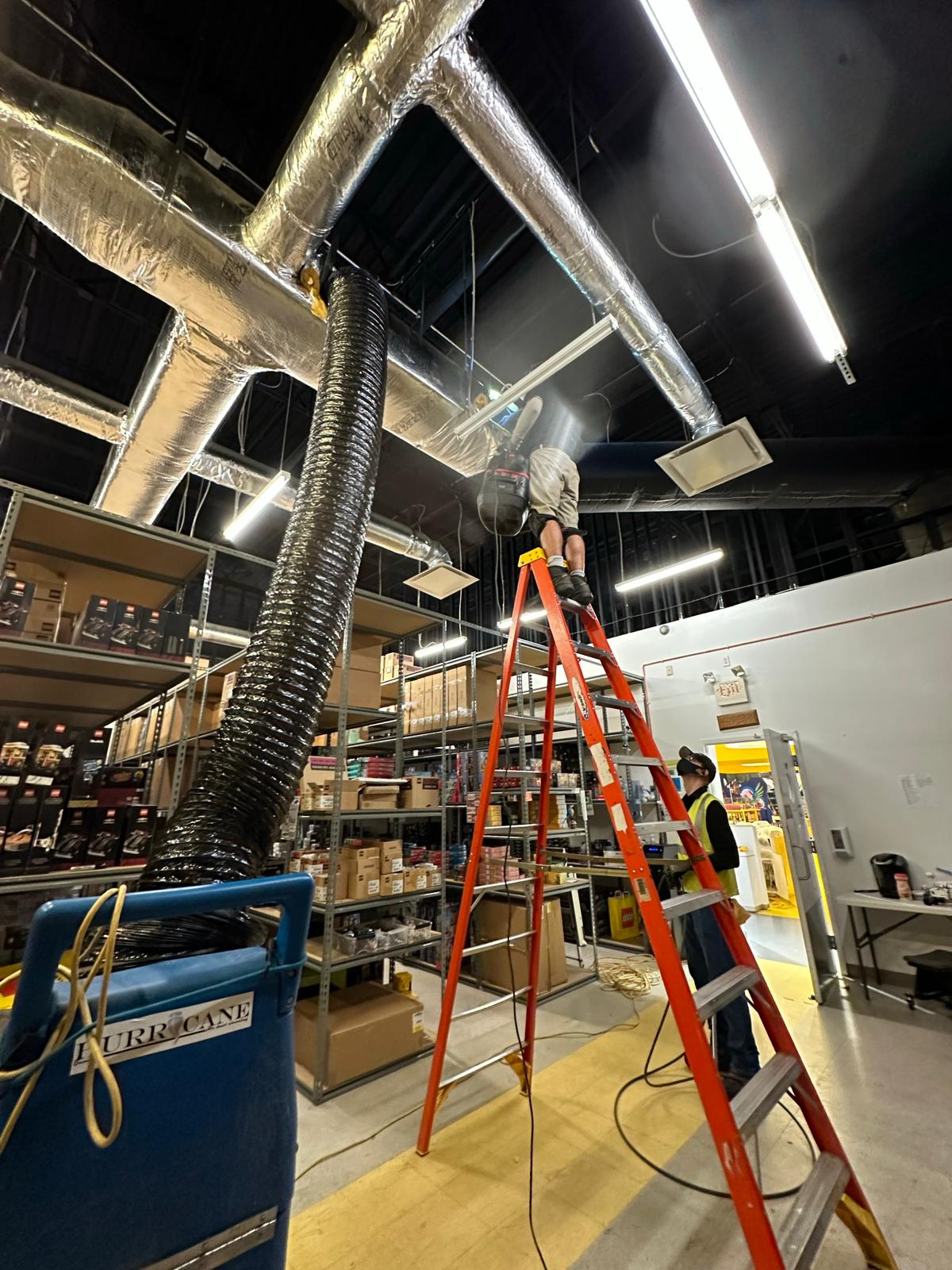LEGO Store stockroom — HEPA negative-air duct cleaning