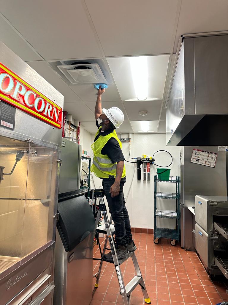 Concession kitchen — diffuser detail cleaning above popcorn and prep line