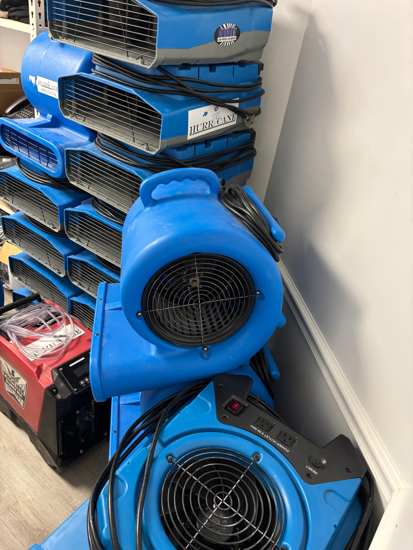 Commercial Air Care air movers and dehumidifiers staged for a commercial job