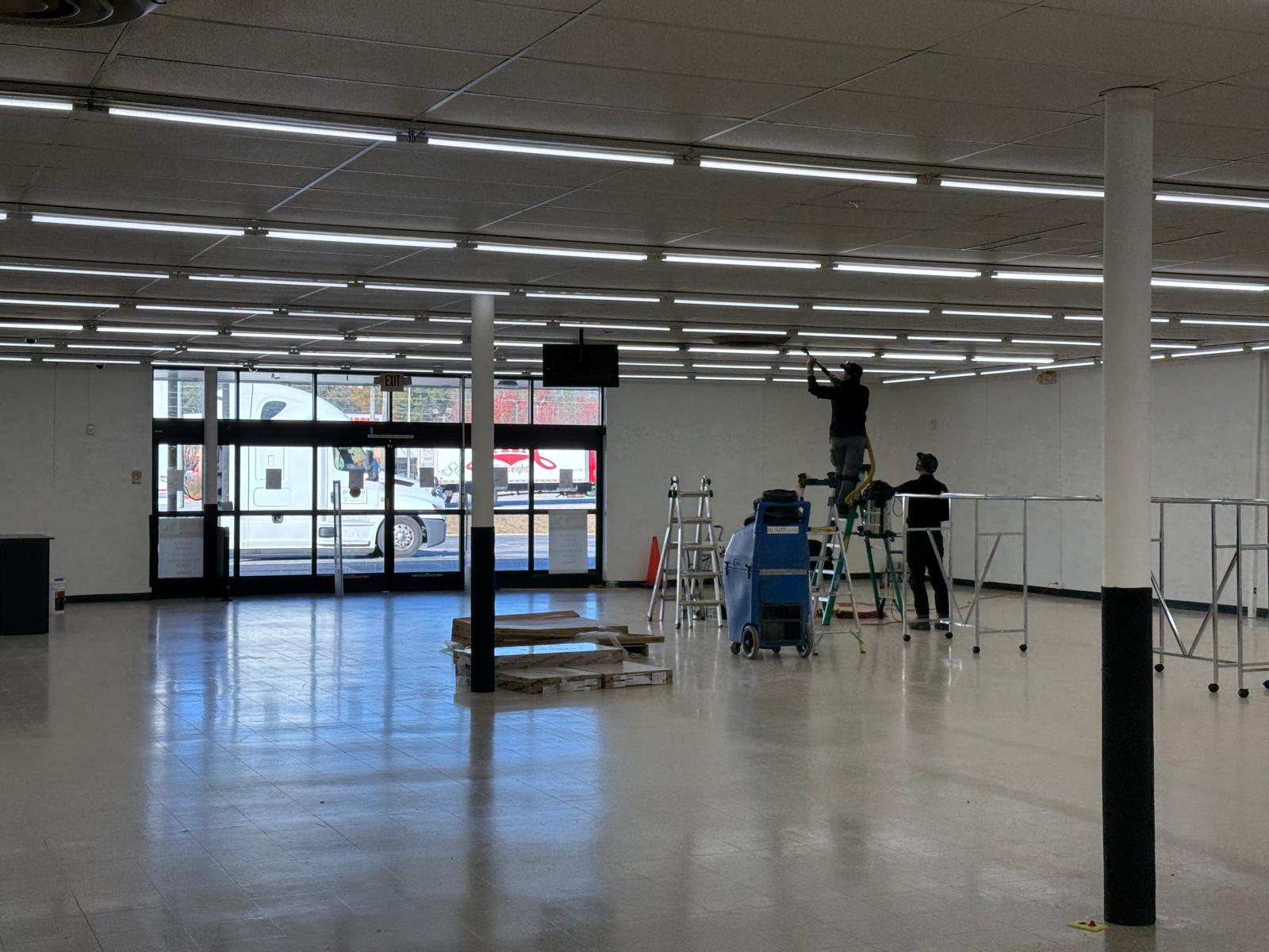 Retail showroom — ceiling diffuser cleaning at the storefront entry