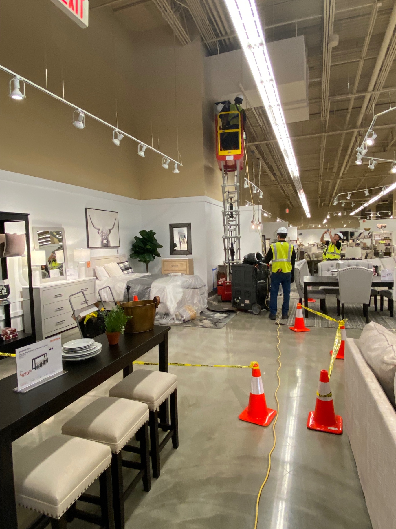 Ashley HomeStore — full-floor containment and lift access
