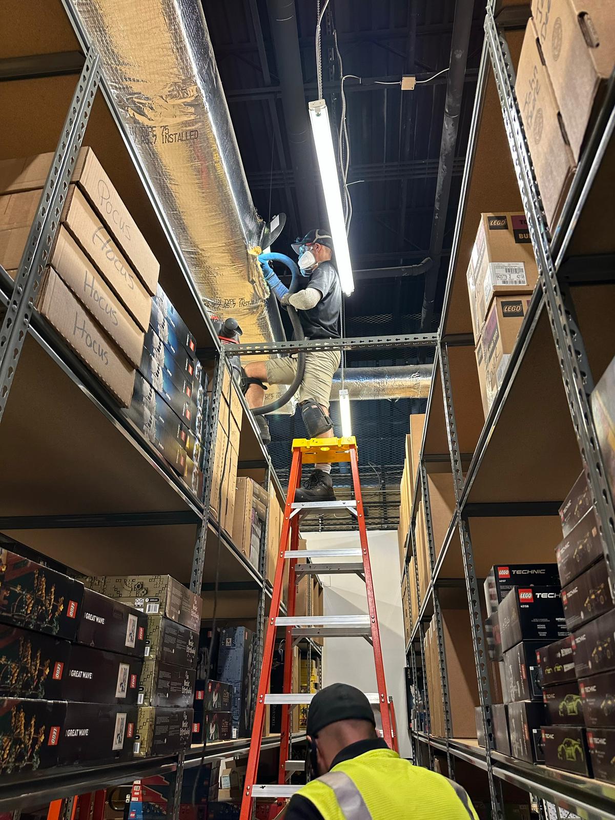 LEGO Store warehouse — insulated duct source-removal cleaning