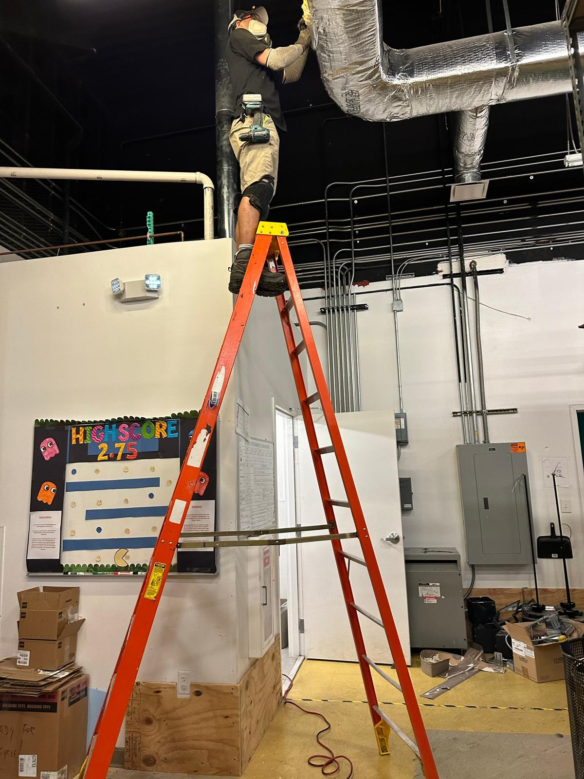 LEGO Store back-of-house — duct sealing and detail work